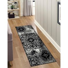 a black and white area rug in a living room