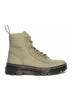 No boots define '90s classic grunge style quite like the Dr. Martens Combs W Boots for Women in Olive Green. With a resurgence in popularity, these Dr. Martens boots feature a canvas like upper, classic lace up construction, and their signature yellow welt stitching. If you're looking for lug boots that are built-to-last these are the perfect boots for you. Features: Dr. Martens Boots Style: 31711357 Color: Muted Olive Women’s Ankle Boots Lace up construction Canvas uppers Nylon lining Back pull tabs for easy on and off Round toe Rubber outsole Welted PVC and EVA midsole EVA foam insole Durable Goodyear welt Imported Measurements from size 7: Shaft Height: 5" Platform Height: 1” Heel: 1 ½” Need to know how to convert your size? Check out our Dr. Martens Size Conversion Chart. If you want m Lug Boots, Goodyear Welt, Grunge Fashion, Lace Boots, Dr. Martens, Fashion Boots, Olive Green, Womens Boots, Ankle Boots