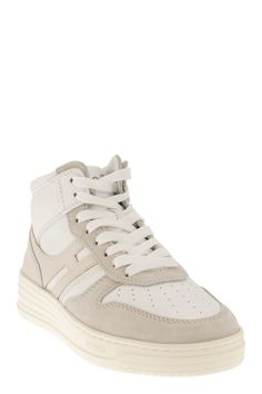 Step up your sneaker game with the HOGAN H630 high top trainers. This retro-inspired design brings a touch of luxury to your casual wardrobe, featuring a smooth leather and suede upper with the iconic elongated H detail wrapping around the heel. The extralight EVA sole is adorned with the new HGN86 logo and shaded stripes, adding a modern twist to the historical rebel grooves. With a memory foam footbed for ultimate softness and cushioning, these trainers are a must-have for anyone who appreciat Contemporary Wardrobe, Italian Luxury Brands, High Top Trainers, Hogan Sneakers, Versace Bags, Sneaker Games, Balenciaga Designer, Eva Sole, Sneaker Wedge