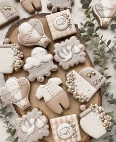 decorated cookies are arranged on a platter with baby's breath and other items