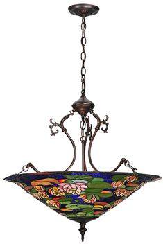 a stained glass chandelier hanging from a chain on an isolated ceiling light fixture