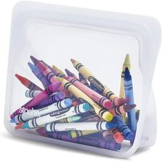 a plastic container filled with lots of crayons