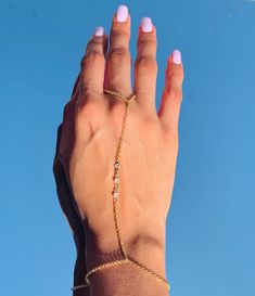 "18 Karat Gold Filled CZ Hand Chain Bracelet length:  Option A: 7\" + 1.5\" Extension Option B: 6.5\" - 3mm Beaded Bracelet Option C: 7\" + 1.5\" Extension Finger Loop: 4\"  Material: 18 Karat Gold Filled, Hypoallergenic. Tarnish Resistant. Gold-filled does not de-laminate or peel like Gold plated Jewelry nor does it tarnish as readily as silver. Generally speaking, gold filled is better quality and will have a much longer lasting color than plated jewelry. Gold filled jewelry is an excellent op Adjustable Metal Jewelry For Promise, Dainty Chain Body Jewelry For Wedding, Adjustable Delicate Chain Body Jewelry As Gift, Adjustable Delicate Chain Body Jewelry For Gift, Party Diamond Bracelet With Adjustable Chain, Dainty Adjustable Metal Body Jewelry, Adjustable Dainty Metal Body Jewelry, Gold Resizable Jewelry For Party, Delicate Chain Bracelets For Parties