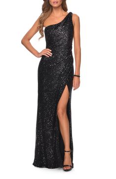 Statutesque and stunning, this one-shoulder gown is covered in dazzling sequins and punctuated with a soaring, stem-showing slit. 60" length Back zip closure One-shoulder neck Sleeveless Lined 100% polyester Spot clean, dry flat Imported Special Occasion Black Maid Of Honor Dress Sparkle, Gala Gowns, Sequin Evening Gowns, 2025 Wedding, Sequin Formal Dress, Sequin Prom Dress, One Shoulder Gown, Prom Style, Glamorous Dresses