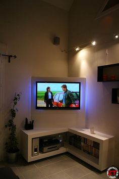 a flat screen tv mounted to the side of a wall