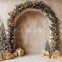 an arch decorated with gold and silver christmas trees, presents and gifts under the archway