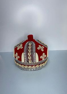 Discover the elegance and cultural significance of the African Crown Hat, a stylish and traditional piece perfect for any occasion. This Nigerian Igbo Traditional Red Odogwu Igwe Hat embodies the rich heritage of the Igbo people, making it an excellent gift for your husband or boyfriend. Crafted with meticulous attention to detail, this red igwe hat is not just a fashion statement but a symbol of honor and respect in Igbo culture. The Odogwu hat is designed for comfort and style, ensuring that i Elegant Red Ceremonial Headpieces, Traditional High Crown Headpiece For Party, Traditional Round Crown Headpiece For Party, Traditional Costume Hat With Structured Crown, Traditional Red Hat With Round Crown, Traditional Ceremonial Headpiece With Pinched Crown, Traditional High Crown Costume Hat For Wedding, Traditional High Crown Ceremonial Hats, Traditional Red Party Hat