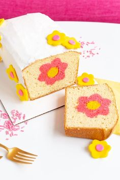 two slices of cake sitting on top of a white plate with pink and yellow flowers