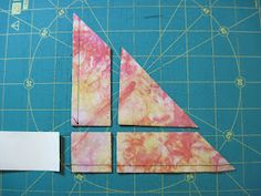 the paper is cut out to make an origami sail