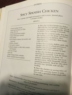 an open book with instructions on how to cook spanish chicken and other foods in it