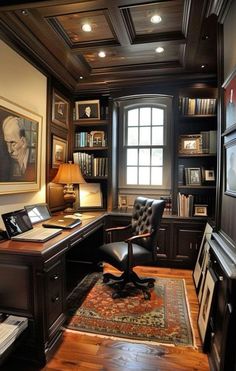 a home office with wooden floors and built in bookshelves, leather chair, desk, and lamp