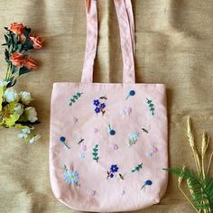 Show off your flower power with this fun tote! With tons of room and a fun design, this bag is the perfect choice for carrying all your essentials in style <3 Hand Embroidered Linen Tote Bag 12.5" x 13.5" Hand Wash, Lay Flat To Dry Spring Cotton Bags With Double Handle, Daily Use Cotton Shoulder Bag With Floral Embroidery, Embroidered Cotton Shoulder Bag For School, Trendy Pink Embroidered Bag, Floral Embroidered Canvas Tote Bag For Everyday Use, Cotton Tote Shoulder Bag With Floral Embroidery, Everyday Cotton Shoulder Bag With Floral Embroidery, Cotton Shoulder Bag With Floral Embroidery, Cotton Shoulder Bag With Floral Embroidery For Everyday Use