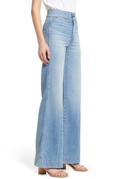 Far-out fashion, in all its groovy glory, comes through in these '70s-inspired jeans cut from Japanese denim with the widest legs we've seen this season. 33" inseam; 24" leg opening; 12" front rise; 14" back rise (size 25) 98% cotton, 2% polyurethane Machine wash, line dry Made in the USA 70s Inspired Wide Leg Flare Jeans For Fall, 70s Inspired Wide Leg Jeans For Spring, 70s Inspired High Rise Jeans For Spring, 70s Inspired Denim Bottoms, 70s Inspired Denim Jeans For Spring, 70s Inspired Spring Denim Jeans, Retro Wide Leg Flare Jeans With Five Pockets, 70s Inspired Spring Jeans, Retro Medium Wash Wide Leg Flares