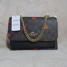 Red Floral Print, Red Bag, Brown Coat, Red Floral, Coach Bags, Brown Color, Gold Hardware, Leather Straps, Floral Print