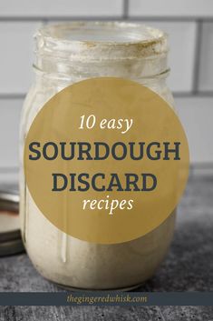 a mason jar filled with sourdough desserts on top of a wooden table