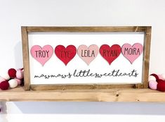 a sign with hearts on it that says try tye ella ryan moira mommy's little sweethearts