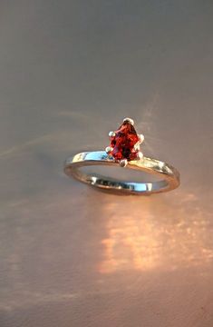 Red Natural Garnet set into a handmade silver ring, stamped "925" and sized at 7 Handmade Silver Ring, 925 Silver Ring, Silver Rings Handmade, Garnet Gemstone, 925 Silver Rings, Rings Statement, Pear Shaped, Handmade Silver, Statement Rings