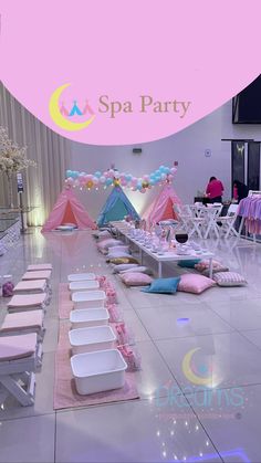 a room filled with lots of tables covered in pink and white cloths for a party