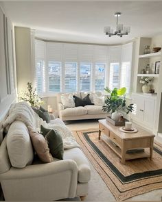 a living room filled with furniture and a fire place