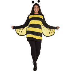 a woman in a bee costume is walking with her arms out and legs spread wide