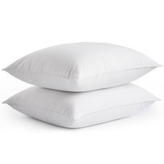 two pillows stacked on top of each other, one is white and the other is plain