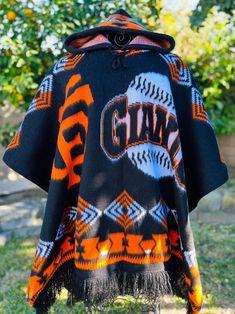 Handcrafted alpaca poncho unisex with hoodie and adjustable strings thick fabric warm and comfortable.  SF Giants Alpaca Poncho, Poncho Design, Sf Giants, Thick Fabric, Alpaca Wool, San Francisco Giants, Ponchos, Alpaca, Favorite Outfit