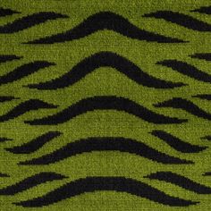 an animal print fabric with black and green colors