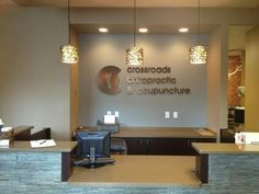 the front desk of crossroads chiropecic and acupunture in an office