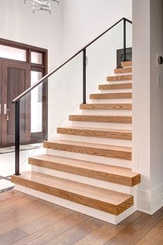 a set of wooden stairs leading up to a door