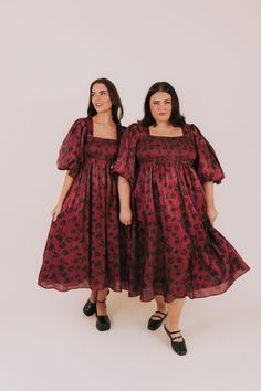 Unleash your inner romantic with the This Heart Of Mine Dress. Featuring a babydoll silhouette and puff sleeves, this midi dress is perfect for a dreamy, feminine look. The smocked bust and back provide a flattering fit, while the square neckline with slight sweetheart elements adds a touch of sweetness. Fully lined, and in a black floral pattern, this dress is both playful and sophisticated. Plus pockets! Details Babydoll silhouette Puff sleeve Fully lined Smocked bust and back Square neckline Valentines Dress, Nursing Friendly Dress, Black Floral Pattern, Plus Jumpsuit, Pockets Details, Valentine Dress, Exclusive Dress, Maternity Shops, Basic Dress