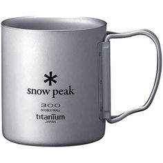 a stainless steel coffee mug with the words snow peak on it's front and side