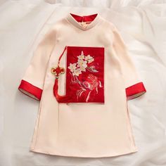 This beautiful modern ao dai set is perfect for any special occasion: Lunar New Year, Mid Autumn Festival, Attending a Wedding, or a Family photoshoot. 🌿 This set includes an Ao Dai top and No pants. Style: Traditional Material: Very well made with high-quality silk suitable for skin kid Collar: 1.5 cm Please provide bust-waist-and hip measurements when placing your order to ensure the best fit for you. 🌿 NOTE: * Recommend gentle washing * Please contact us for any inquiries about size. We don Wedding Ao Dai With Intricate Embroidery, Elegant Long Sleeve Cheongsam With Floral Embroidery, Traditional White Cheongsam For Wedding, Embroidered Long Sleeve Ao Dai For Ceremony, Traditional Ao Dai With Floral Embroidery For Ceremony, White Embroidered Ao Dai For Wedding, Traditional Embroidered Ao Dai For Ceremony, Traditional Ao Dai With Floral Embroidery For Wedding, White Ao Dai For Festive Occasions