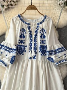 DETAILS: Please refer size chart before choosing. Embroidery details on sleeves, neck and hem. Round neck with tie details Synthetic fiber material composition Product code: 123724 SIZE CHART: Size: M-L Bust: 41.5" Waist: 39" Sleeve:20.5" " Length: 37" Peasant Style Embroidered Tunic Dress For Spring, Long Sleeve Folk Embroidered Dress For Summer, Traditional Summer Dress With Embroidered Sleeves, Folk Style Long Sleeve Embroidered Dress For Summer, Folk Style Long Sleeve Embroidered Summer Dress, Traditional Long Sleeve Embroidered Summer Dress, Embroidered Long Sleeve Dress For Summer Beach, White Peasant Embroidered Long Sleeve Dress, Half Sleeve Embroidered Dress For Spring