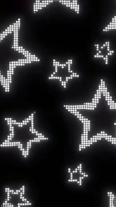 an array of pixelated stars on a black background