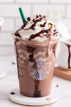 there is a drink with chocolate and whipped cream in it