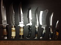 there are many knives lined up on the wall