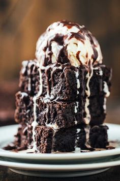 a stack of brownies with ice cream on top