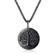 a necklace with a tree on it and a chain hanging from the bottom of it