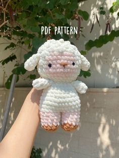 a small crocheted stuffed animal is held up by someone's hand with the text, free pattern