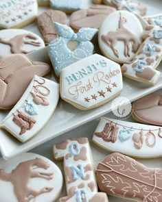 decorated cookies are sitting on a plate