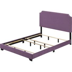 a purple bed frame with wooden posts and nail polishing on the headboard is shown