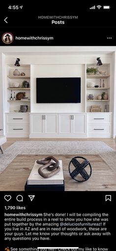 the living room is clean and ready to be used as a media center for movies