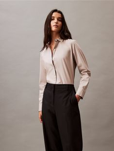 A tailored piece with a structured silhouette, these trousers are wrinkle-resistant and crafted with 4-way stretch for ease of movement. Cut in a straight leg fit with a zip fly and a top button closure. Finished with slip pockets at the sides and welt pockets at the back.  Material: 66% Polyester, 31% Viscose, 3% Elastane.