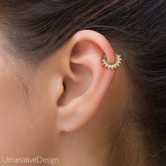 a woman's ear is shown with a small flower in the middle