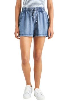 Take it easy in these summery chambray shorts topped with an elastic waist and a dainty drawstring. 2 1/2" inseam; 26" leg opening; 11" front rise; 15" back rise Elastic/drawstring waist Front slant pockets 100% lyocell Machine wash, tumble dry Imported Chambray Shorts, Hairstyling Products, Led Fashion, Rollerball Perfume, Drawstring Shorts, Beauty Trends, Drawstring Waist, Chambray, Short Tops