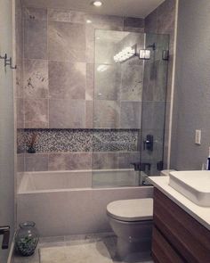 Bathroom with grey tiles Small Bathroom Remodel With Tub Tile, Bathroom Tile Large, Small Bathroom Remodel With Tub, Recessed Shelf, Bathroom Tub Shower Combo, Dark Grout, Makeover Kamar Mandi, Fresh Bathroom, Large Tiles