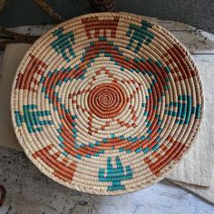 a woven basket sitting on top of a table