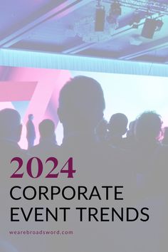 a group of people standing in front of a screen with the words, 2012 corporate event trends