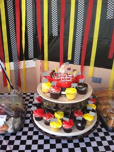 Red yellow black cupcakes race car cake 2 Fast 2 Curious Birthday Cupcakes, Race Track Cupcakes, Race Cupcakes, Cupcake Race Car, Cupcake Race Track, Black Cupcakes, Birthday Fiesta