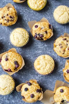 blueberry muffins are lined up on a baking sheet and ready to be eaten